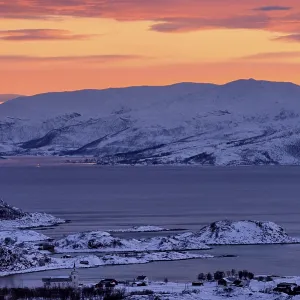 Fjord with islands in winter at sunset