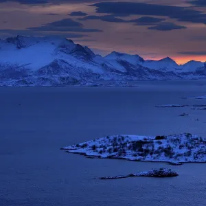 Fjord with mountains in winter at sunset Fjord with mountains in winter at sunset