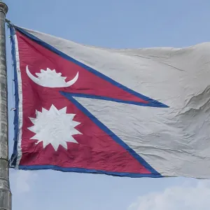 The flag of Nepal, fluttering in the wind The flag of Nepal, fluttering in the wind