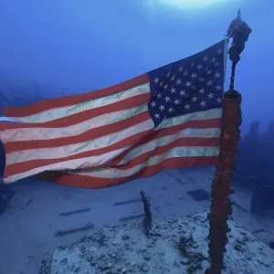 US flag waving in the current on the wreck of the USS Spiegel Grove US flag waving in the current on the wreck of the USS Spiegel Grove