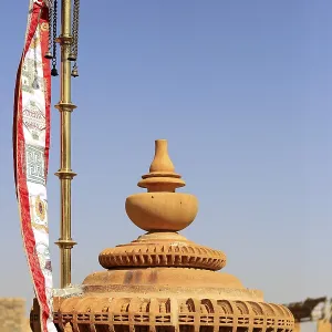 Flags and detail reliefs on rooftops of Jain temple in Jaisalmer