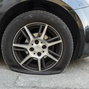 A flat tyre on a car, Wuppertal, Germany A flat tyre on a car, Wuppertal, Germany