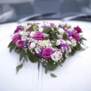 Flower heart, flower decoration on decorated wedding car Flower heart, flower decoration on decorated wedding car