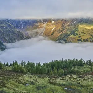Fogg and clouds in the Mountains in early fall at Hochalpenstrasse Fogg and clouds in the Mountains in early fall at Hochalpenstrasse