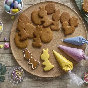 Food, Decorating Easter cookies with colored icing Food, Decorating Easter cookies with colored icing