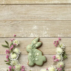 Food, Wooden background with easter bunny cookies and flowers Food, Wooden background with easter bunny cookies and flowers