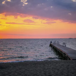 Footbridge at sunrise over the sea