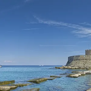 Fort of Saint Nikolaos stretches along the coast in the bright sunshine