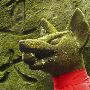 Fox statue with rice ball, Fushimi Inari Taisha shrine Fox statue with rice ball, Fushimi Inari Taisha shrine