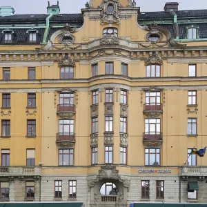 A fragment of the architectural design of the facade in the Art Nouveau style of a residential building in the city