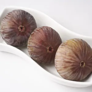 Fruit, Figs kept ins shape white plate Ficus Carica Anjir on white background