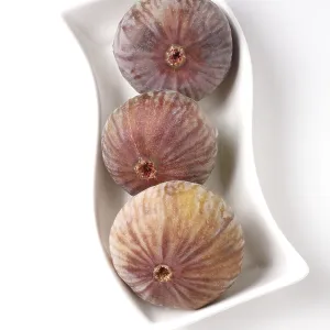 Fruit, Figs kept ins shape white plate Ficus Carica Anjir on white background
