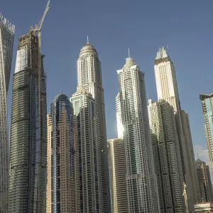 Futuristic skyline with a series of skyscrapers under clear skies