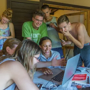 German Teenagers sitting in front of laptop