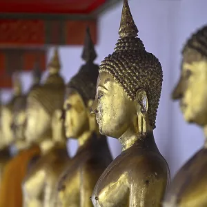 Gilded Buddha statues in Wat Pho Gilded Buddha statues in Wat Pho