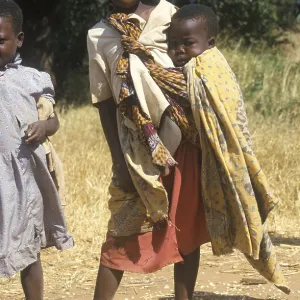 Girl carrying a toddler, Bwangu Mzimba Girl carrying a toddler, Bwangu Mzimba