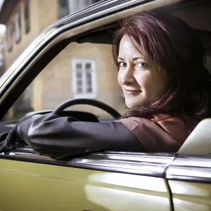 Girl in front of Post-War classic car