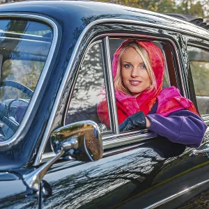 A girl with post-war classic car A girl with post-war classic car