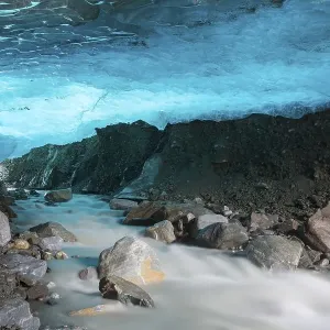 Glacier cave with a stream, Pasterze glacier Glacier cave with a stream, Pasterze glacier