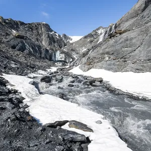 Glacier ice and glacier stream with waterfall