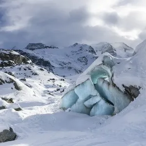 Glacier tongue in front of a mountain peak