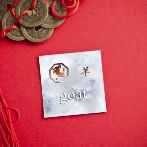 Goat zodiac card with Chinese character on a red background with coins