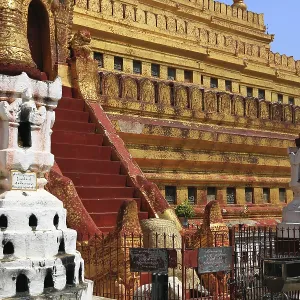 Gold-decorated Shwezigon Pagoda with ornate steps and ornaments Gold-decorated Shwezigon Pagoda with ornate steps and ornaments