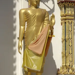 Golden Buddha with mudra sign for energy