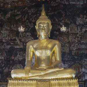 Golden Buddha statue, Phra Buddha Trilokachet surrounded by crystal chandeliers and exquisite wall paintings Golden Buddha statue, Phra Buddha Trilokachet surrounded by crystal chandeliers and exquisite wall paintings
