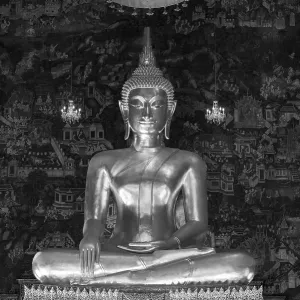 Golden Buddha statue, Phra Buddha Trilokachet surrounded by crystal chandeliers and exquisite wall paintings Golden Buddha statue, Phra Buddha Trilokachet surrounded by crystal chandeliers and exquisite wall paintings