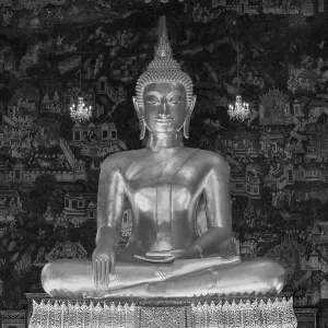 Golden Buddha statue, Phra Buddha Trilokachet surrounded by crystal chandeliers and exquisite wall paintings Golden Buddha statue, Phra Buddha Trilokachet surrounded by crystal chandeliers and exquisite wall paintings