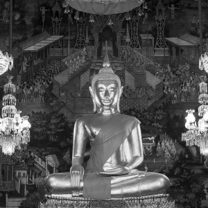 Golden Buddha statue, Phra Buddha Trilokachet surrounded by crystal chandeliers and exquisite wall paintings