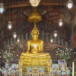Golden Buddha statue with Bhumispara-mudra