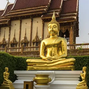 Golden Buddha statues in front of Wat Baan Rai Golden Buddha statues in front of Wat Baan Rai
