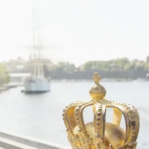 Golden crown on bridge in central Stockholm Golden crown on bridge in central Stockholm