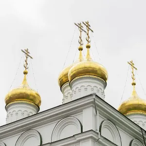 Golden domes on a white church Golden domes on a white church