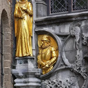 Golden figures on the facade of the St