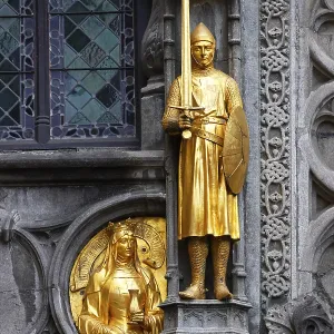 Golden figures on the facade of the St