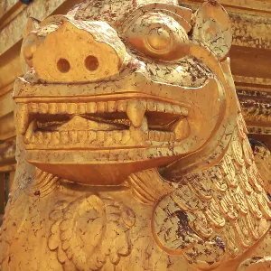 Detail of a golden guardian statue in front of Shwezigon Pagoda in Nyaung-U Detail of a golden guardian statue in front of Shwezigon Pagoda in Nyaung-U