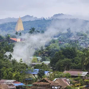 Golden pagoda and the morning fog at sangklaburi Golden pagoda and the morning fog at sangklaburi