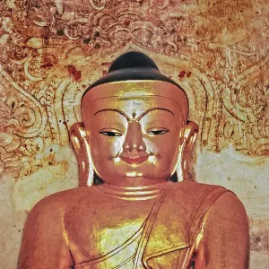 Golden smiling Buddha figure in Sweden