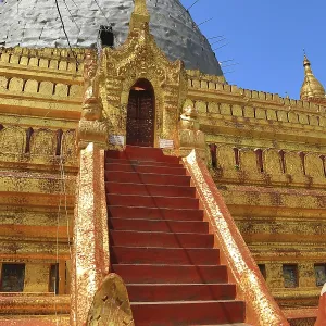 Golden Staircase leads to the dome of Shwezigon Pagoda in Nyaung-U Golden Staircase leads to the dome of Shwezigon Pagoda in Nyaung-U