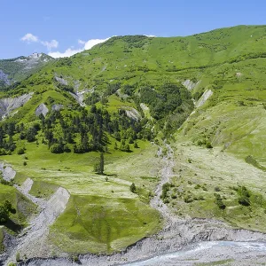 Green hills with a valley and river