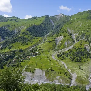 Green valley with mountains and river under blue sky and few clouds Green valley with mountains and river under blue sky and few clouds