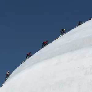 A group of climbers paint Ruwanwelisaya or Ruwanweli Maha Seya Stupa
