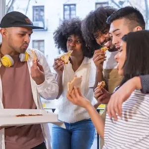 Group of friends eating pizza on the terrace at home, Print