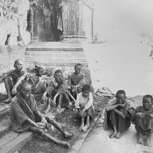 Group of leprosy patients. Sick beggars at the entrance to a temple in Rangoon