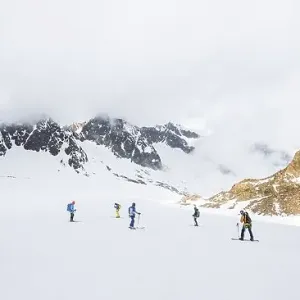 Group of ski tourers and splitboarders on the descent at Alpeiner Ferner