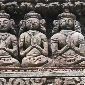 Group of statues of women are sitting and praying Group of statues of women are sitting and praying