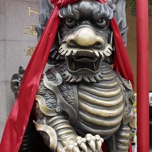 Guardian lion, decorated with red ribbon Guardian lion, decorated with red ribbon